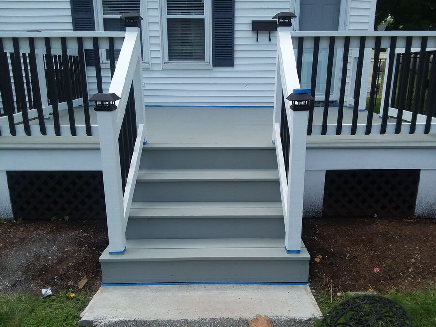 New deck stairs with white railings