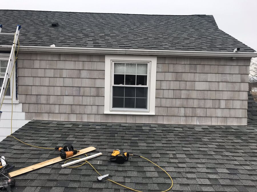 New window and shingle siding installation